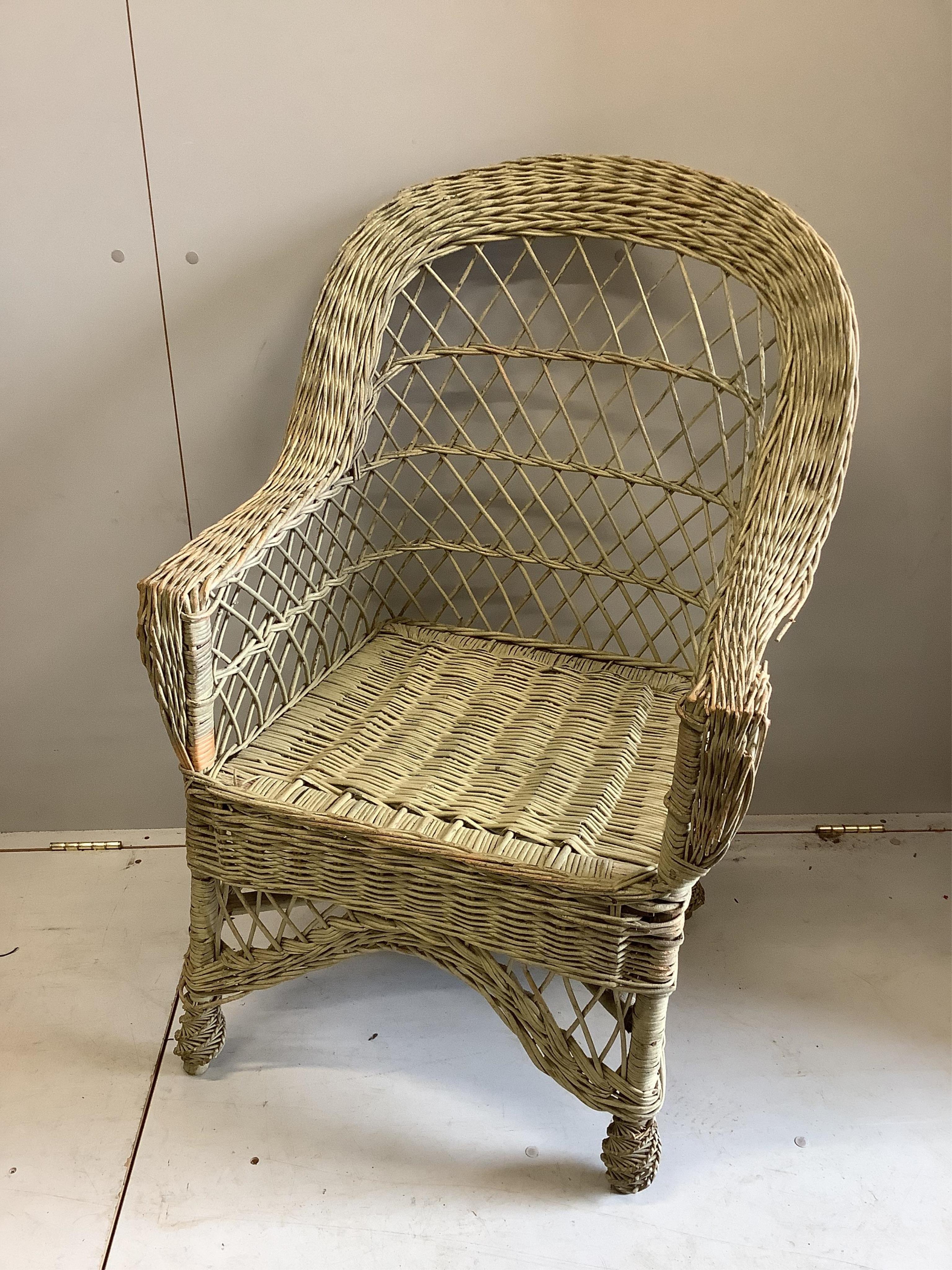 A vintage painted wicker garden armchair, width 64cm, depth 48cm, height 101cm. Condition - fair